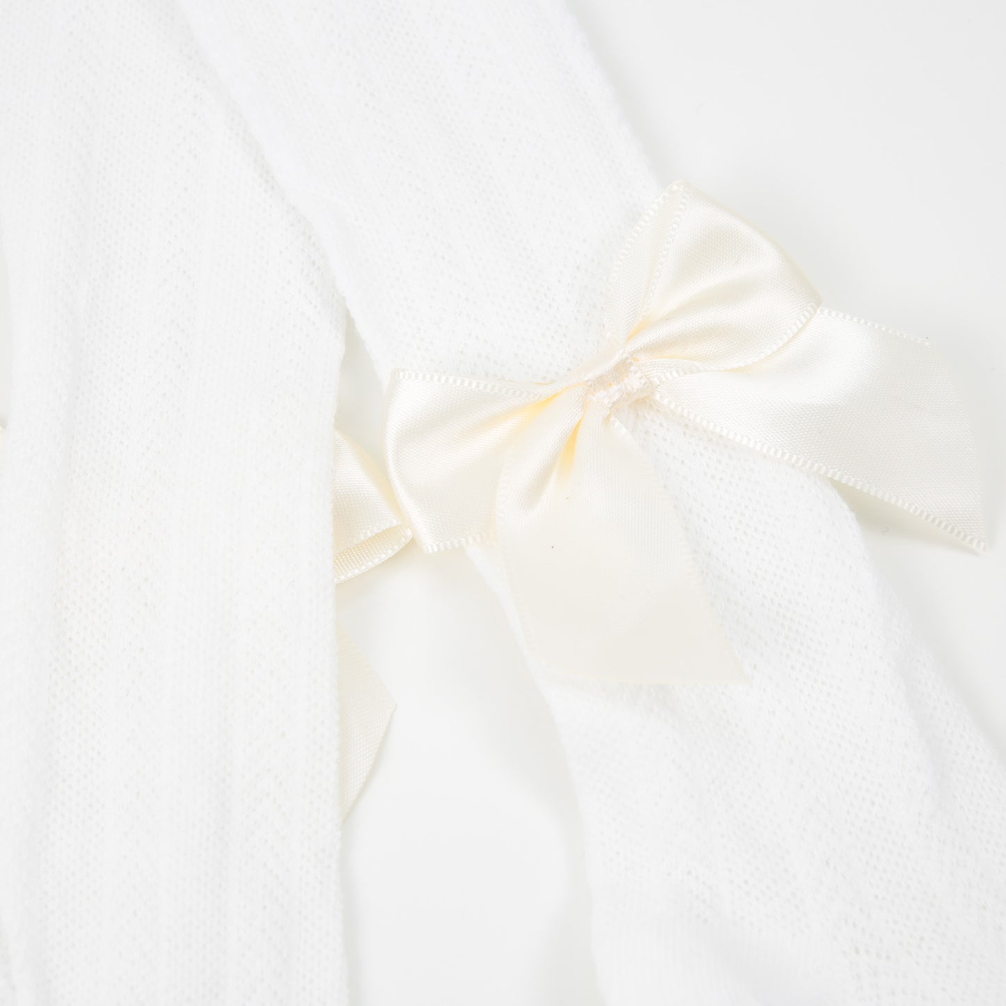 Strumpfhose Lochmuster Satinschleife weiß